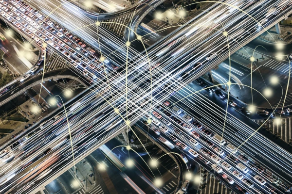 A futuristic smart city with AI-driven traffic management, connected vehicles, and high-speed 6G communication networks.