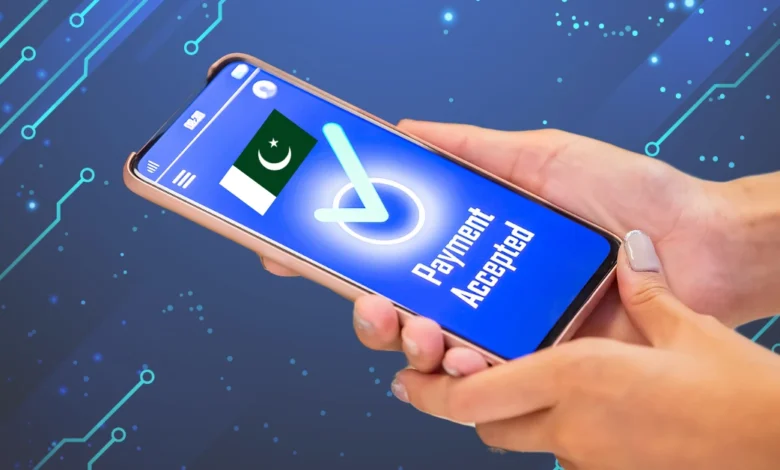 A person holding a smartphone displaying a digital pakistan payment confirmation screen with a "Payment Accepted" message and a Pakistani flag, set against a futuristic tech-themed background.