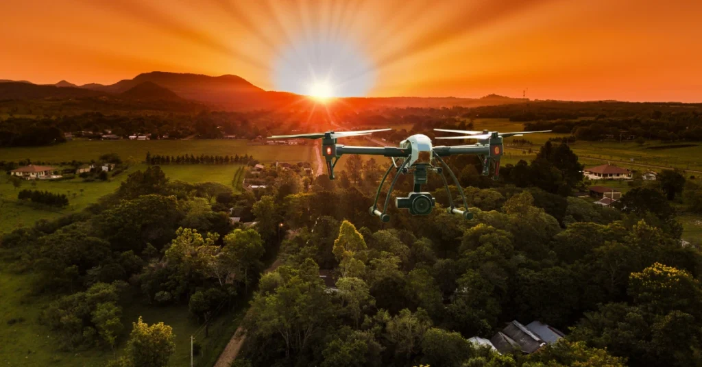 Waterproof drone flying above a green landscape, Camera upgrades during a vibrant sunset