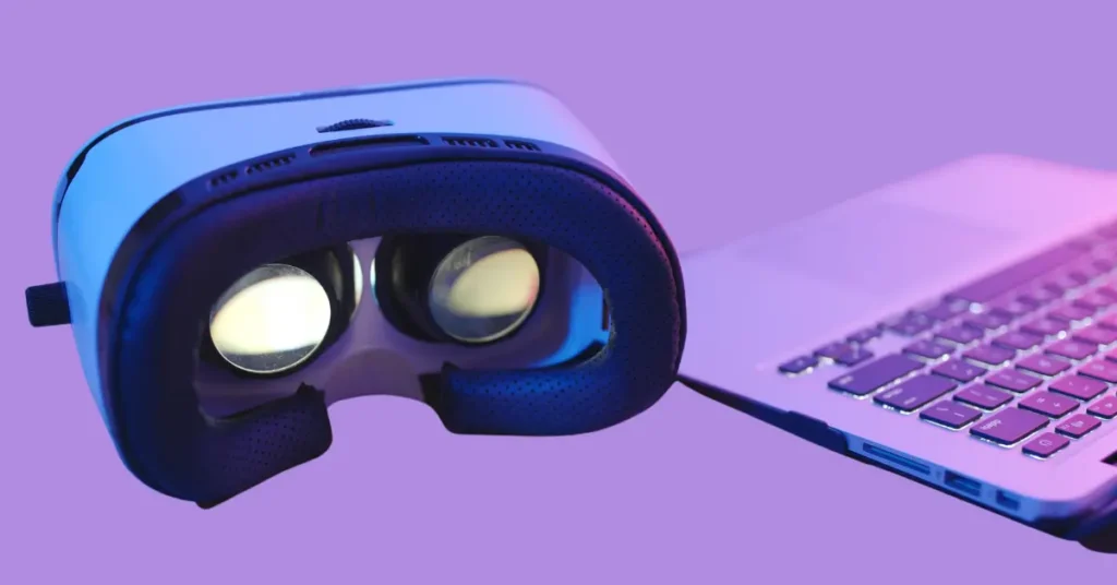 Close-up of a virtual reality headset next to a laptop keyboard on a purple background, surrounded by smart home devices, wearable fitness gear, and a sleek 2-in-1 laptop and tablet, highlighting multi-functional tech gadgets in a modern setup.