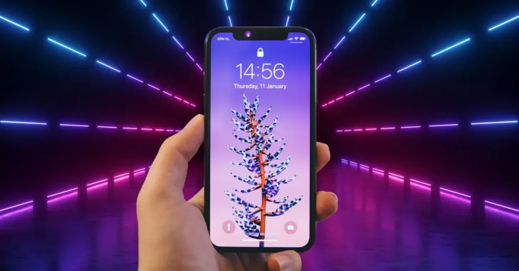 Hand holding a futuristic Apple flip model smartphone with vibrant neon lights in the background.